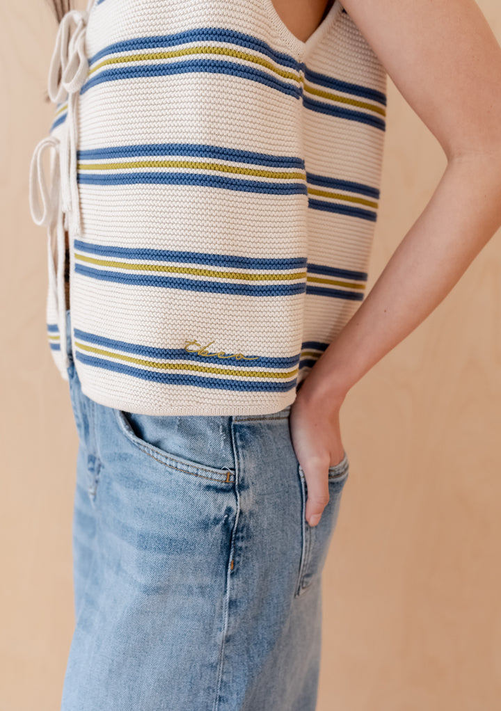TBCo Cotton Knitted Vest featuring blue and yellow stripes on cream background with side adjustable ties