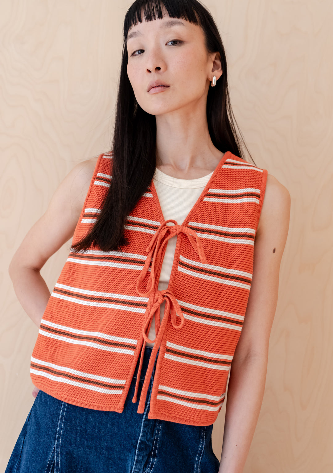 TBCo Cotton Knitted Vest in tangerine and cream stripe pattern with front tie closure, showcasing garter stitch detailing