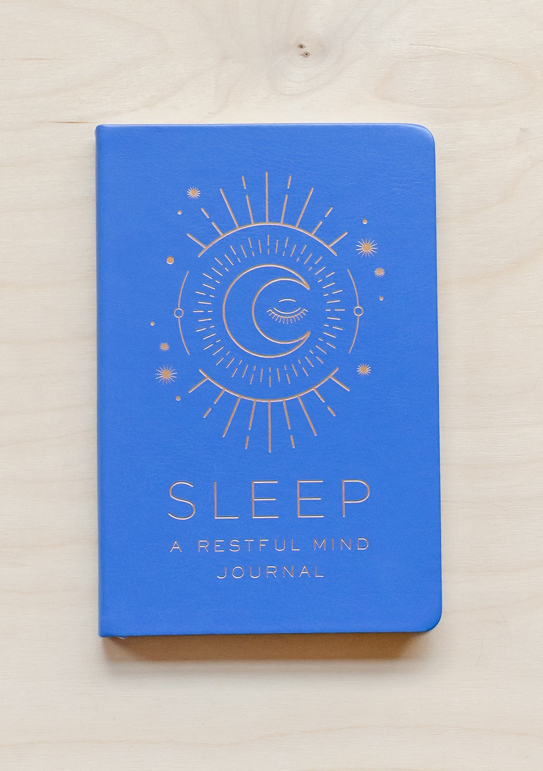 TBCo Sleep: A Restful Mind Journal featuring blue cover with gold moon and stars celestial design, perfect for bedside journaling