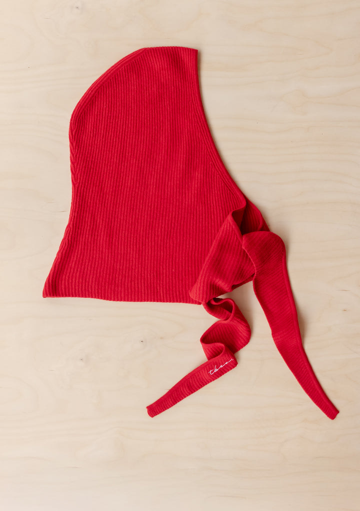 Red Merino Hood in Red by TBCo laid flat showing ribbed texture and long ties for styling versatility