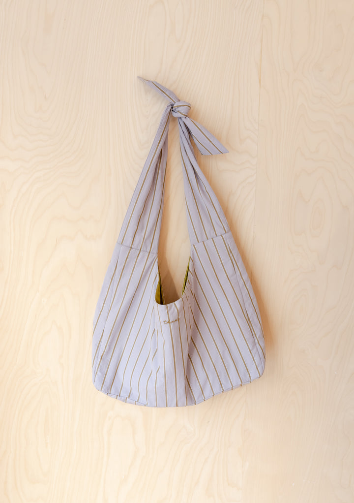 TBCo Large Cotton Multi Knot Bag in lilac and brown stripe pattern, displayed on light wooden background
