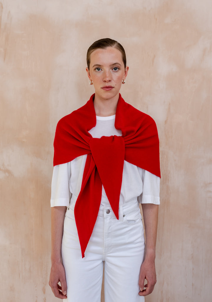 Model wearing a Large Merino Triangle Scarf in Red by TBCo styled over a white shirt and jeans
