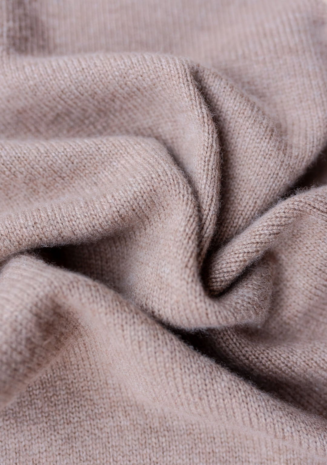 Close-up texture of TBCo Merino Triangle Scarf in Coffee showing soft, knitted wool fabric with gentle folds and draping