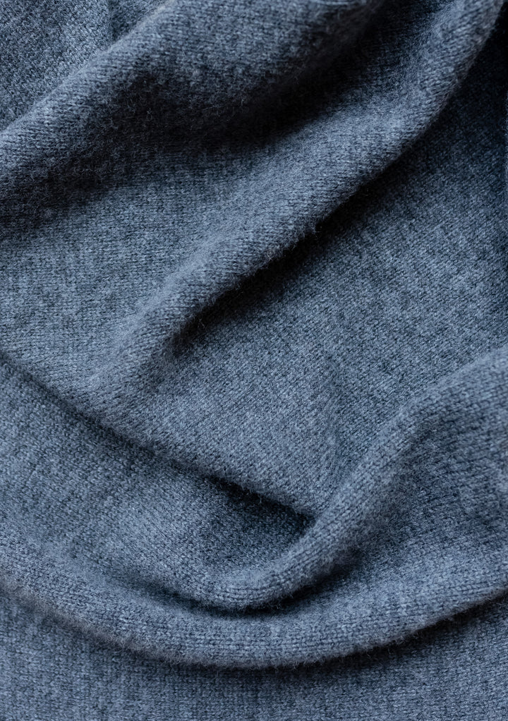 Close-up texture of TBCo Large Merino Triangle Scarf in charcoal melange showing soft wool knit fabric draping detail