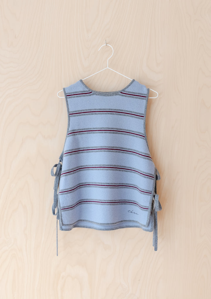 Merino Wool Tie Vest in Blue Stripe by TBCo features breathable merino wool with side tie closures and a casual striped design.