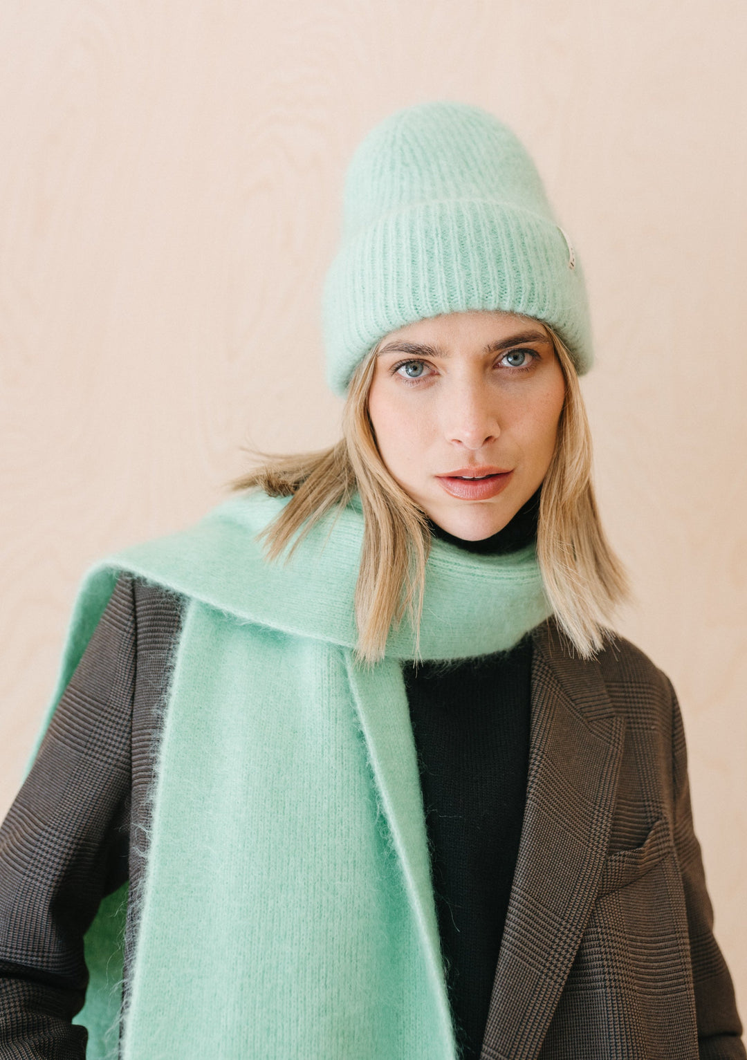 Luxurious mint-coloured TBCo Mohair & Wool Beanie with ribbed texture, styled with matching scarf and grey blazer
