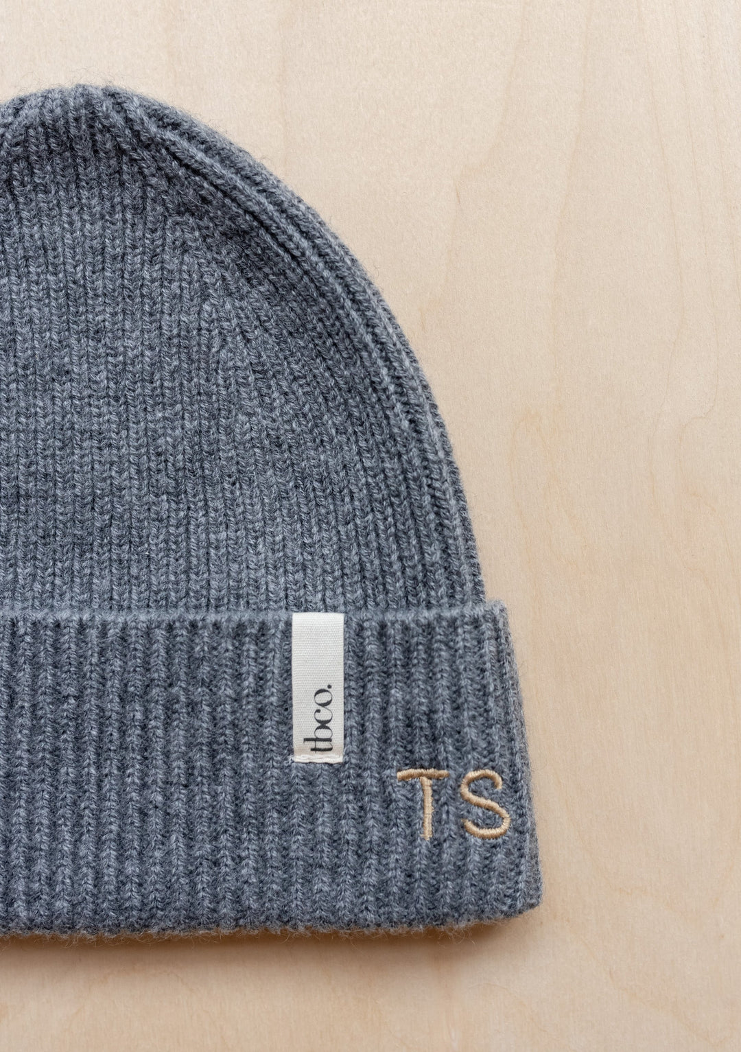 TBCo Merino Wool Kids Beanie in Blue, ribbed knit winter hat with fold-up brim and brand label, made for children