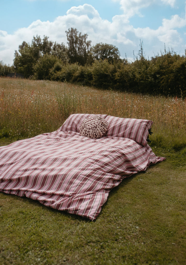 Housse de coussin en coton à carreaux roses 