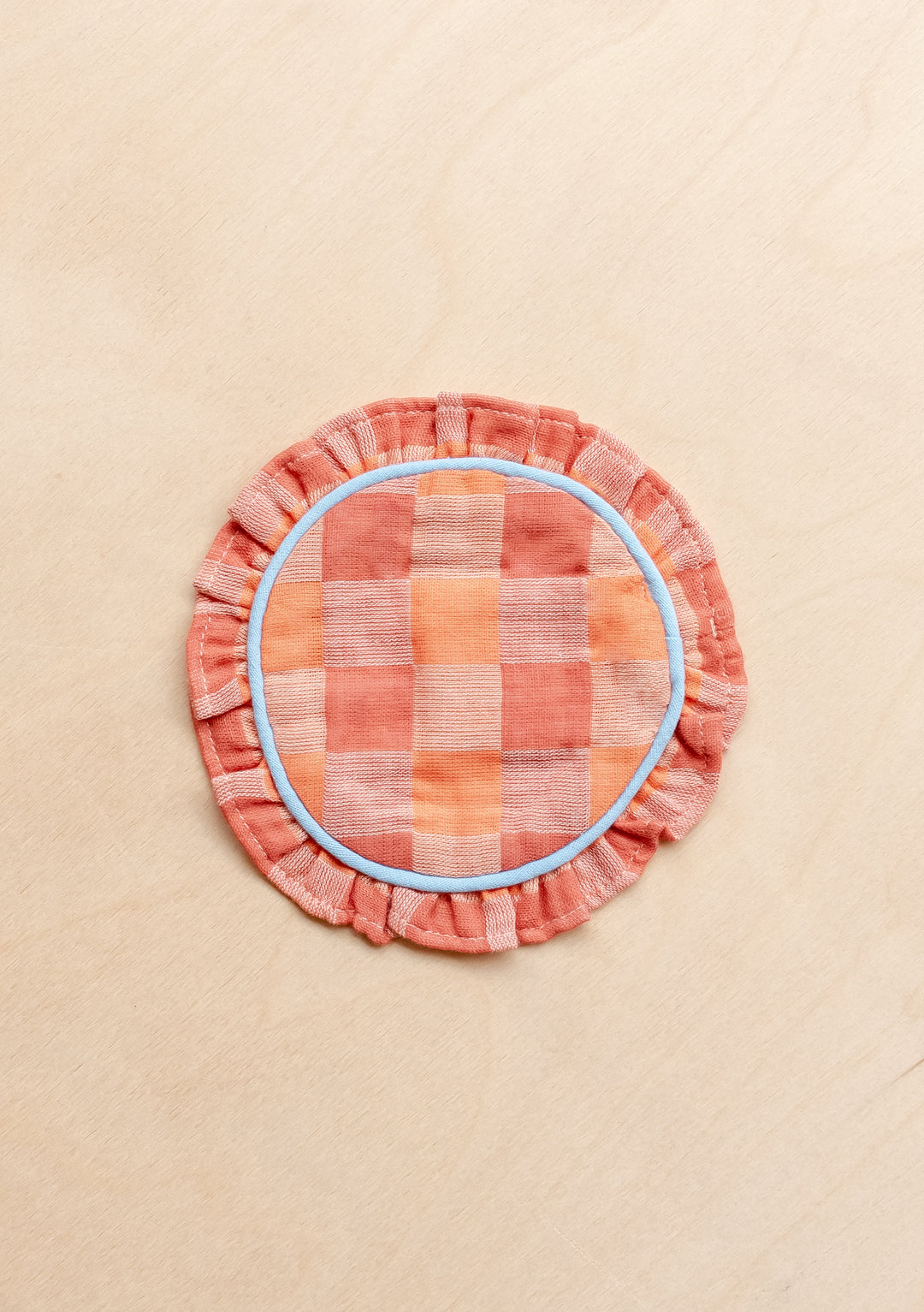TBCo Cotton Coasters Set of 2 in Apricot Checkerboard with ruffled hem and blue piping, portrait gallery position one
