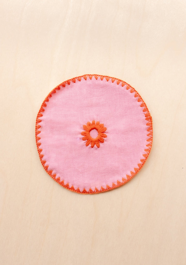 TBCo cotton coasters in pink linen featuring a soft woven texture design . Designed for stylish and practical table protection, these eco-friendly coasters add warmth and sophistication to any home decor.