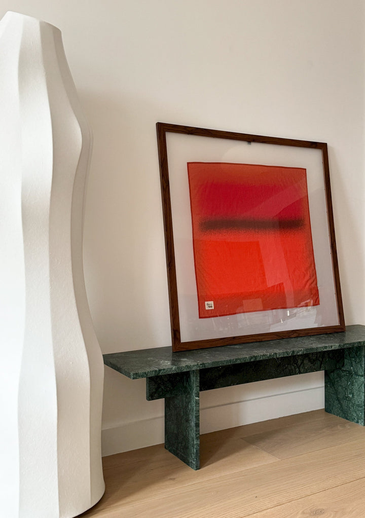 Framed Sample Sale TBCo x Abisola Omole Hues Cotton Scarf displayed on a green marble bench in a modern room