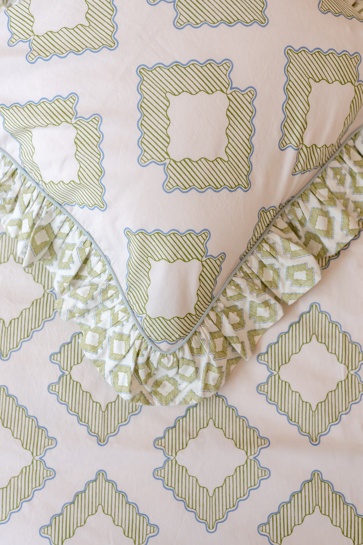 Detailed close-up of TBCo Cotton Duvet Cover & Pillowcases Set in Green Diamond with soft ruffled edges and delicate geometric design