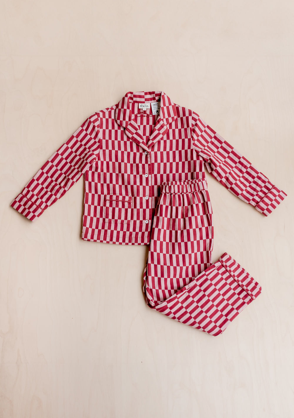 TBCo Cotton Kids Pyjamas in pink and red checkerboard pattern with collared top and matching elastic-waist trousers