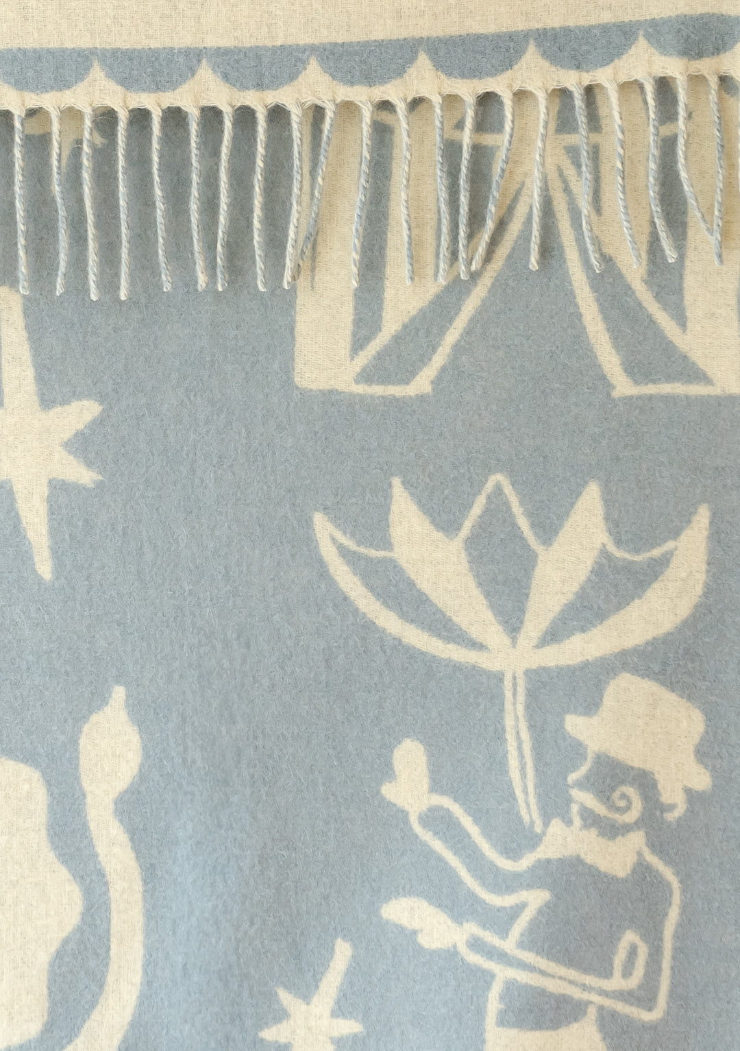 Babydecke aus Lammwolle im Zirkus-Jacquard 