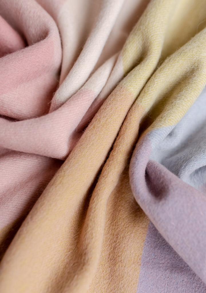 Close-up of TBCo Lambswool Baby Blanket in Pink Block Check showing soft texture and gentle pastel colours in portrait gallery position 3