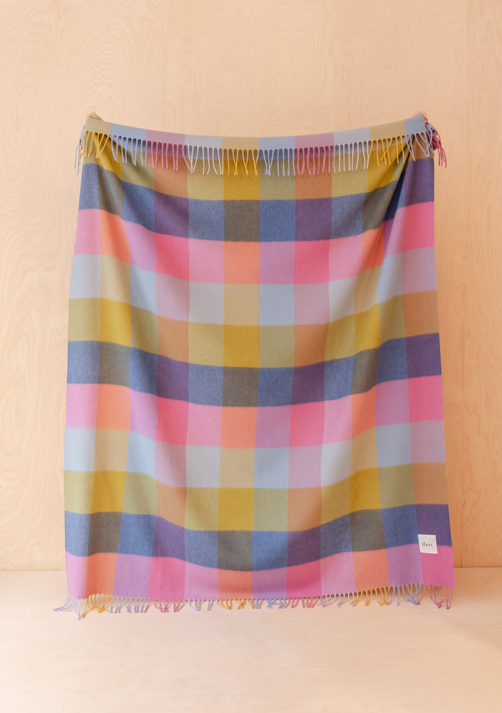 TBCo Lambswool Blanket in Pink Block Check displayed flat showing vibrant check pattern and delicate fringed edges