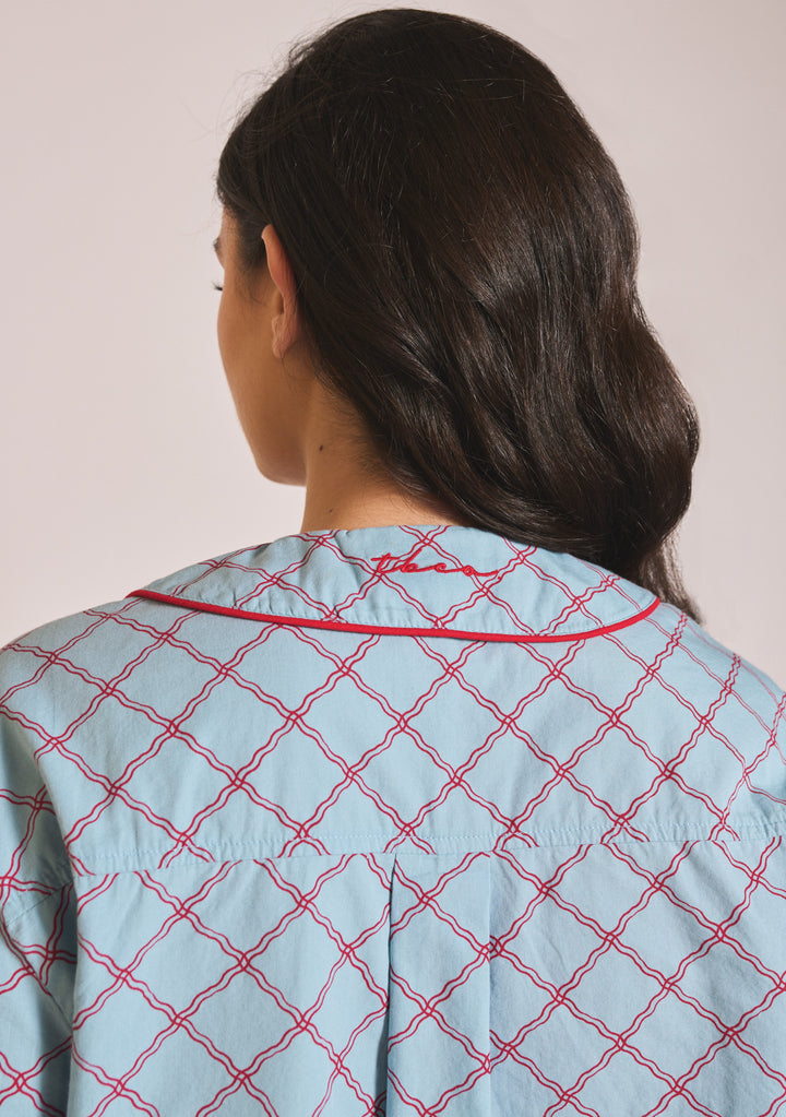 Back view close-up of TBCo Cropped Cotton Pyjamas in Blue Lattice showing red lattice pattern and piping detail