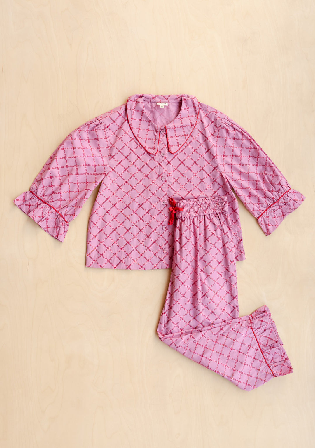 Cropped Cotton Pyjamas in Pink Lattice by TBCo, portrait gallery shot 7, soft cotton top and trousers laid flat
