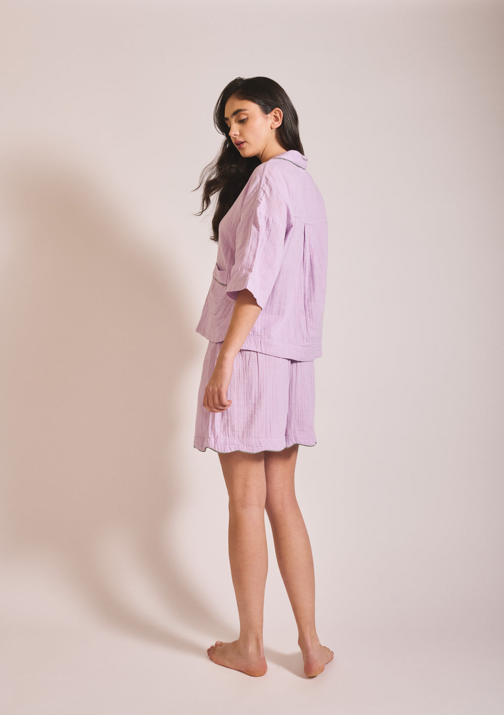 Model wearing TBCo Cotton Pyjamas in Lilac shown in portrait, gallery position 2, with relaxed fit and soft texture