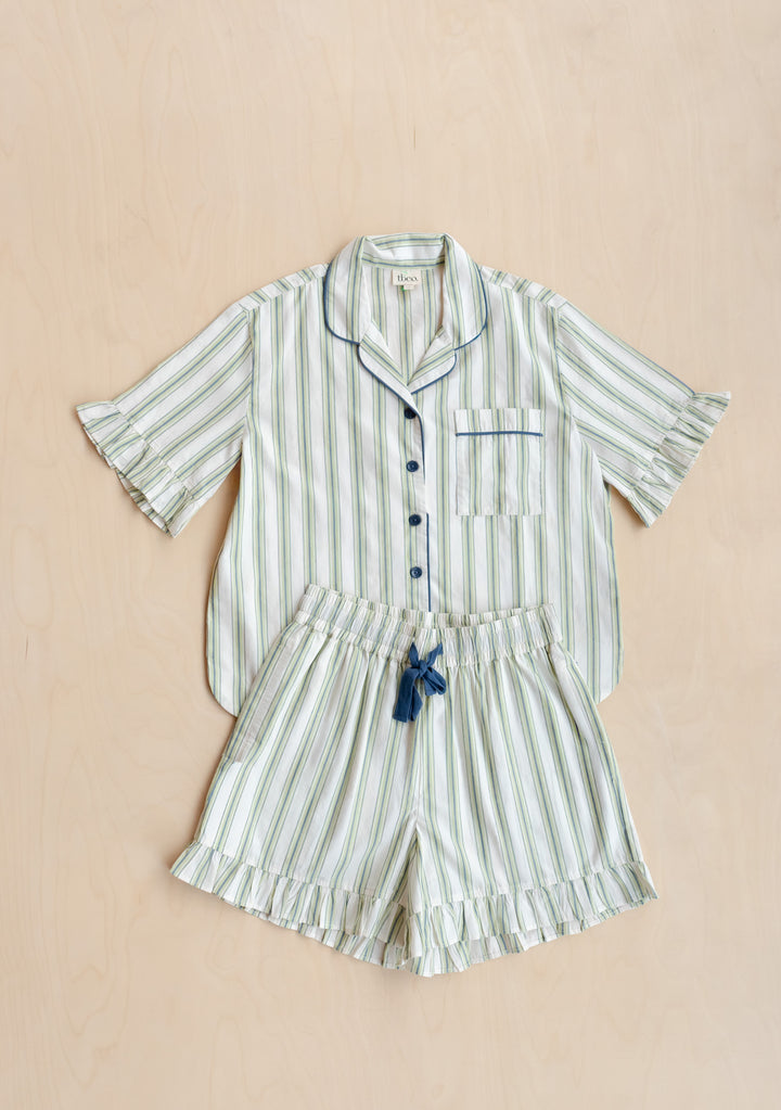 Cotton Pyjamas in Olive Stripe Ruffle by TBCo laid flat in portrait, gallery position 8, showing breathable cotton shorts set