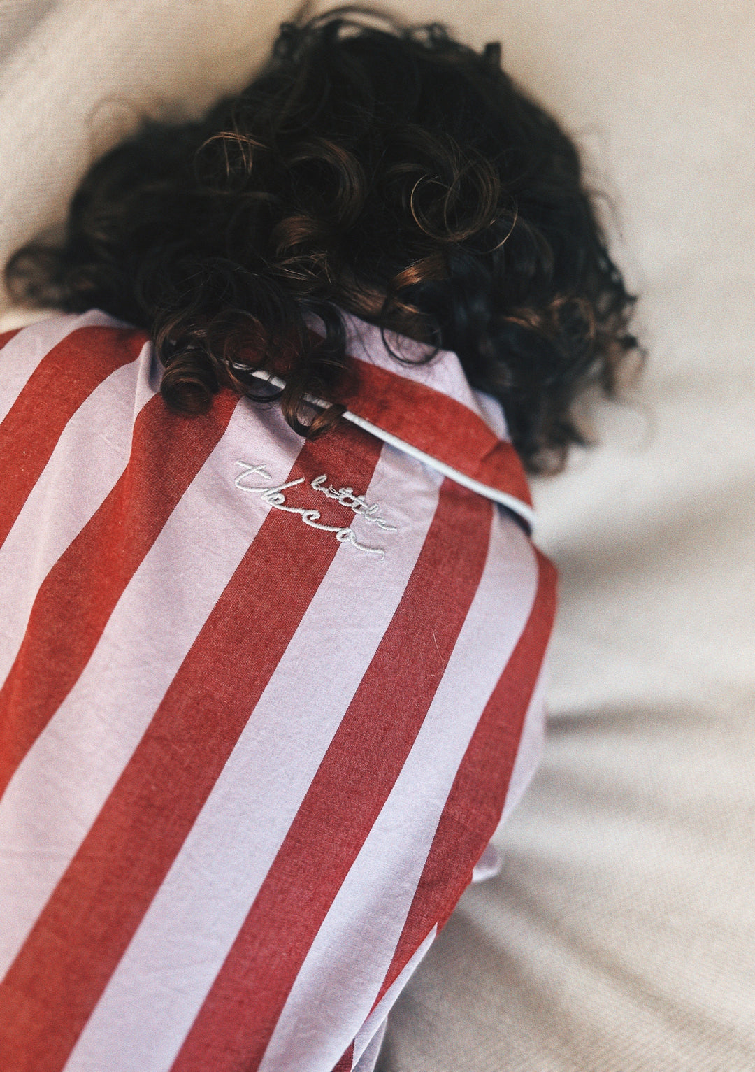 Cotton Kids Pyjamas in Lilac Stripe by TBCo, featuring pink and lilac stripes with custom embroidery on cotton fabric.