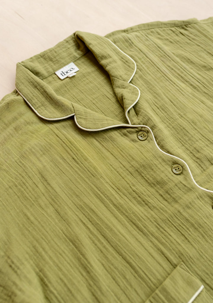 Close-up portrait of TBCo Cropped Cotton Pyjamas in Green with yellow piping, gallery position 7, 1442x2048px
