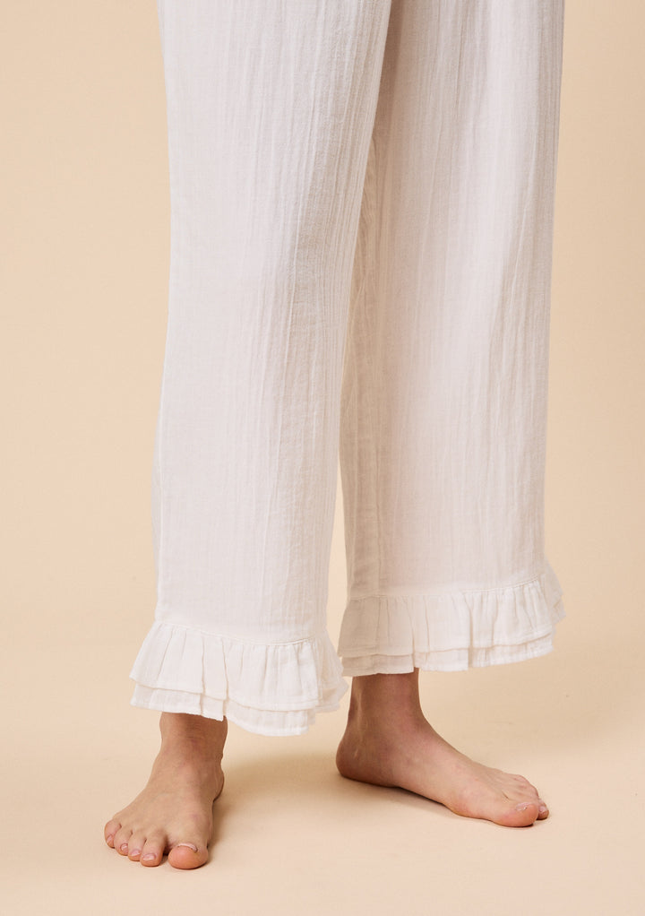 Close-up of TBCo Ankle Grazer Cotton Pyjamas in White Ruffle with breathable natural & recycled fibres, Certified B-Corp, women-founded, designed to make an impact