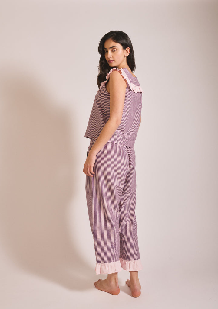 Model in portrait wearing TBCo Cropped Cotton Pyjamas in Burgundy Stripe Ruffle, gallery position 3, 1442x2048 dimensions