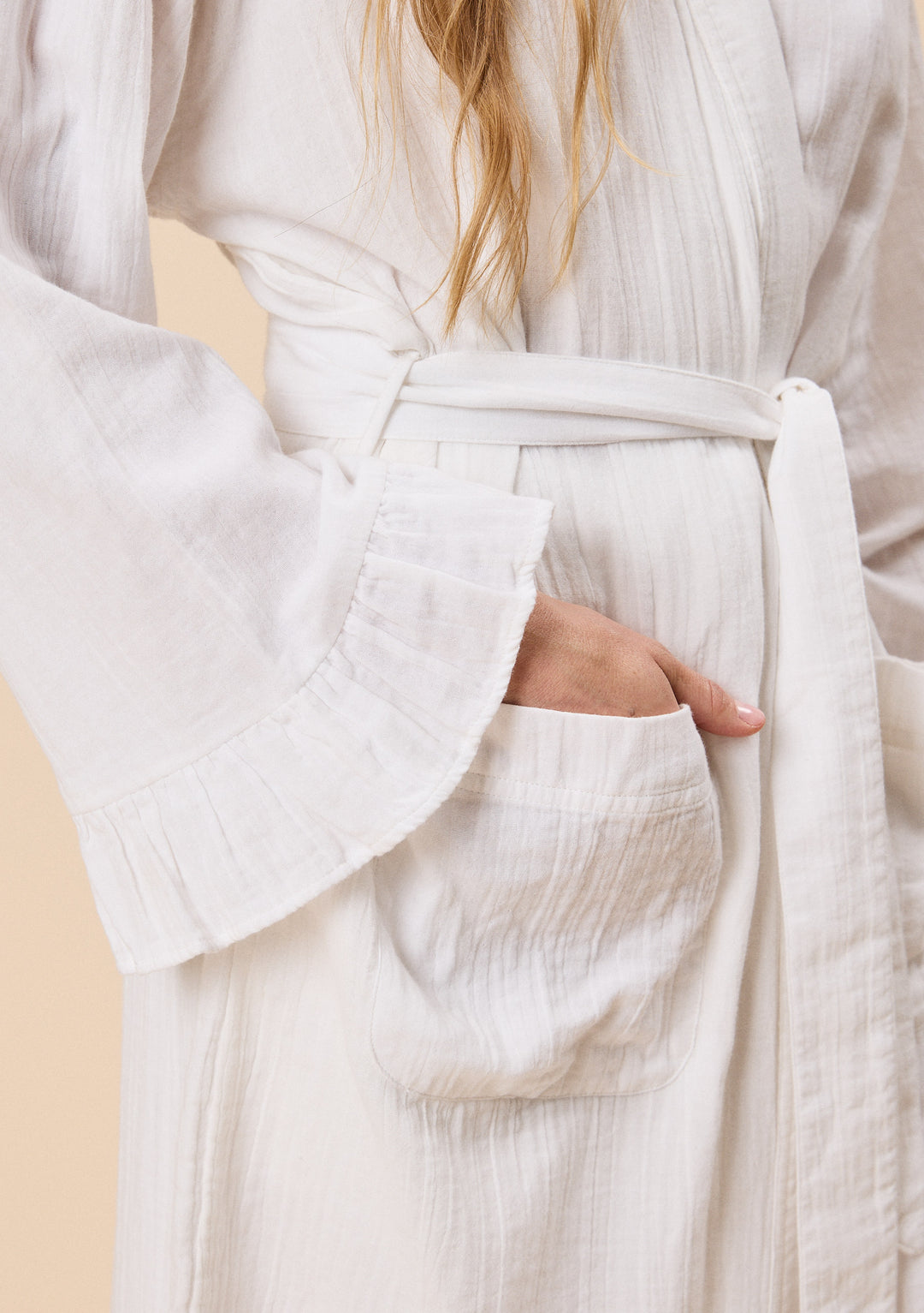 Close-up of TBCo Cotton Robe in White Ruffle with natural and recycled fibres, breathable fabric, Certified B-Corp, women-founded, designed to make an impact