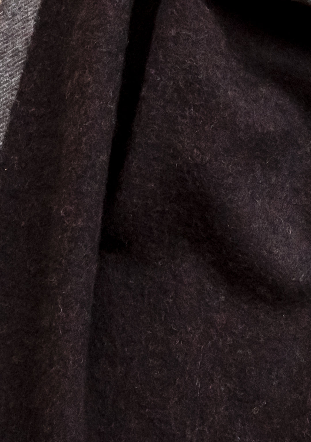 Close-up detail of TBCo's Cashmere & Merino Scarf in Brown Contrast Edge showing luxurious wool texture and weave pattern