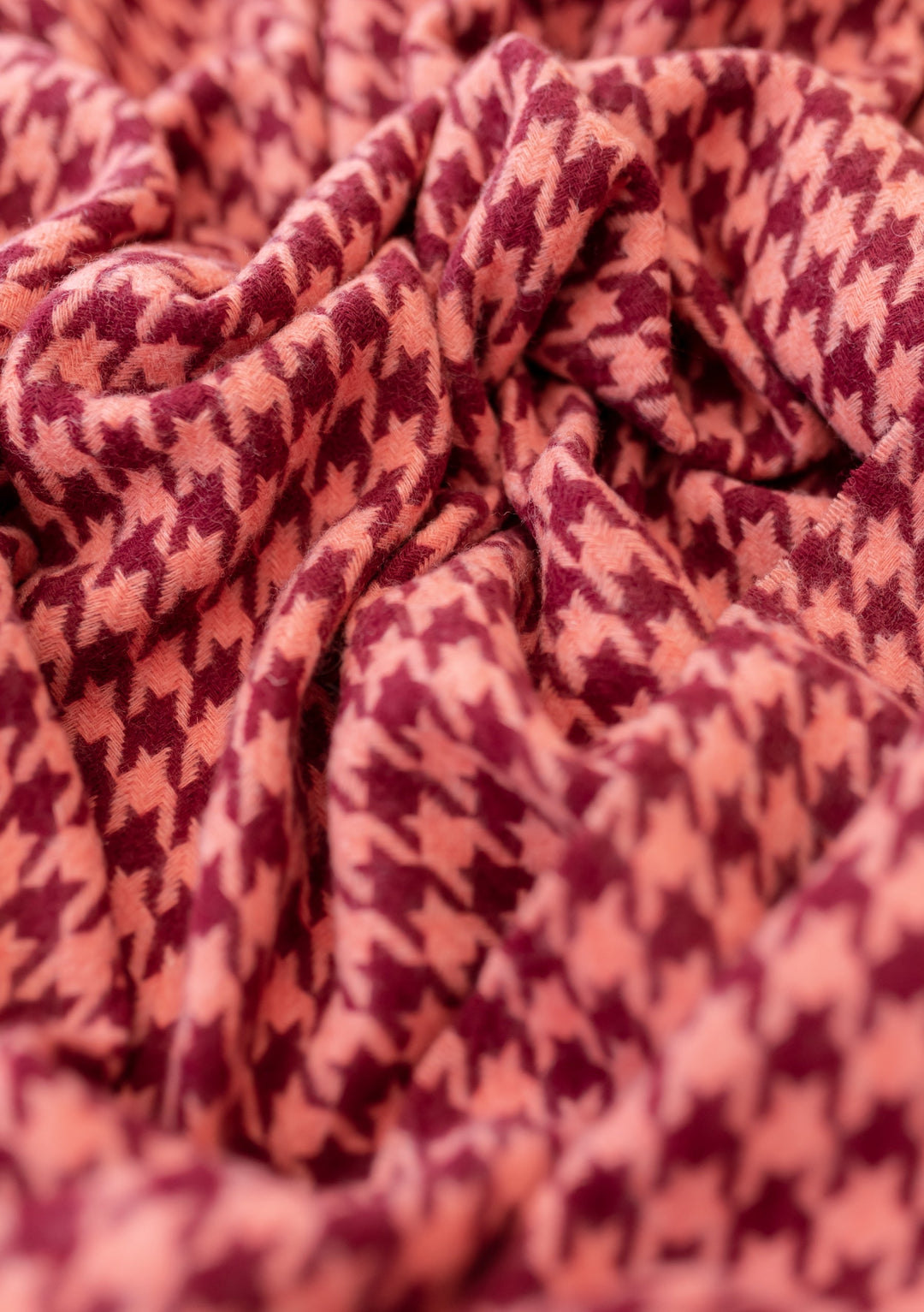 Close-up of TBCo Lambswool Oversized Scarf in Berry Houndstooth pattern showing detailed textile weave and soft texture