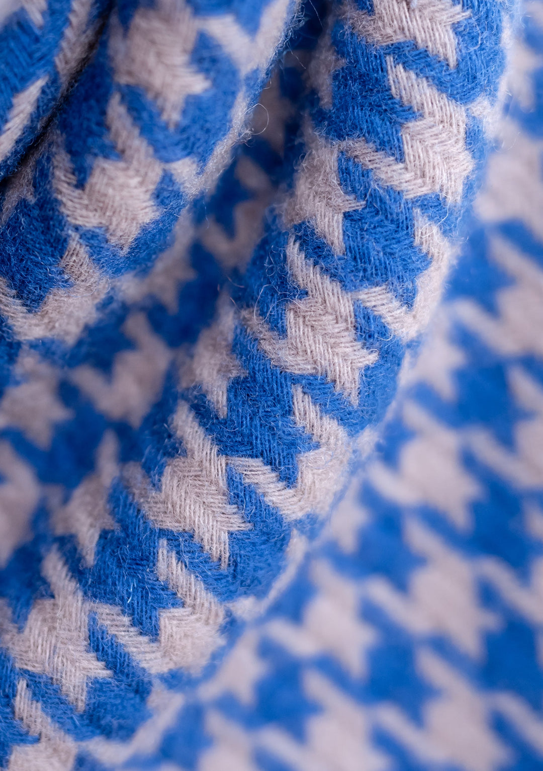 Close-up detail of TBCo's Lambswool Oversized Scarf in Slate Houndstooth pattern showing blue and grey woven texture