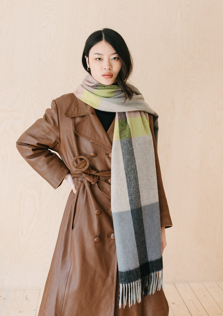 TBCo Lambswool Blanket Scarf in Slate Modern Check styled with brown leather trench coat showing grey and lime check pattern