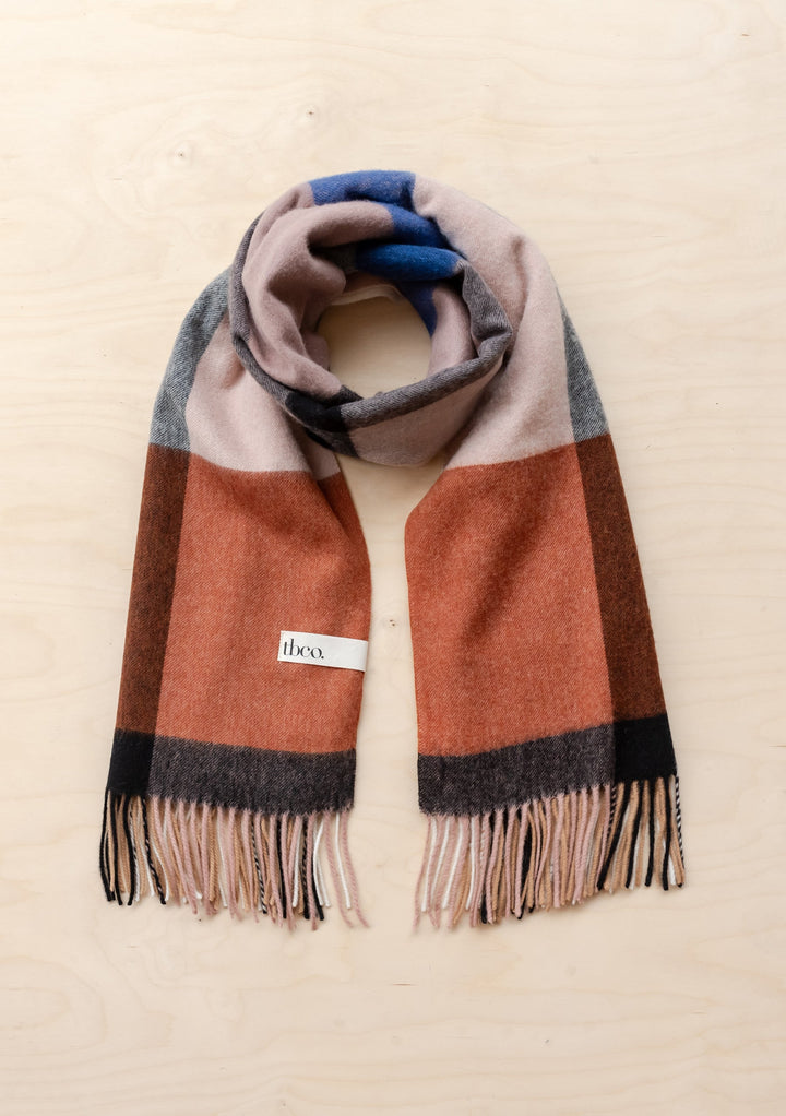 TBCo Lambswool Blanket Scarf in Camel Modern Check displayed flat showing fringed ends and multicoloured checkered pattern