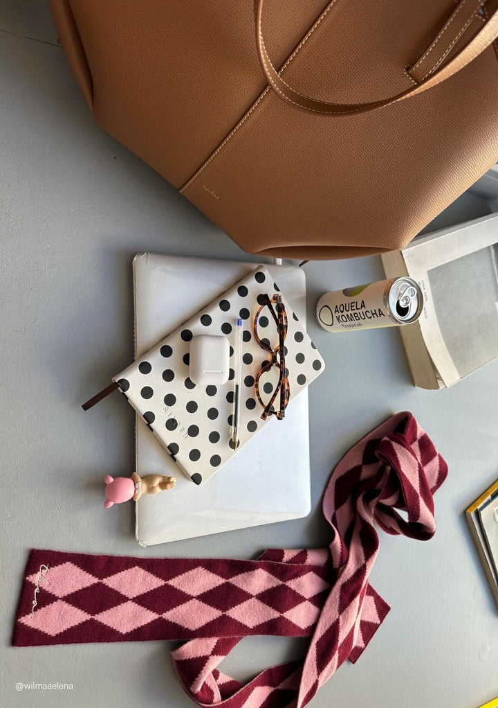 TBCo Merino Wool Skinny Scarf in Burgundy Harlequin with natural fibres, styled alongside everyday essentials, designed to make an impact