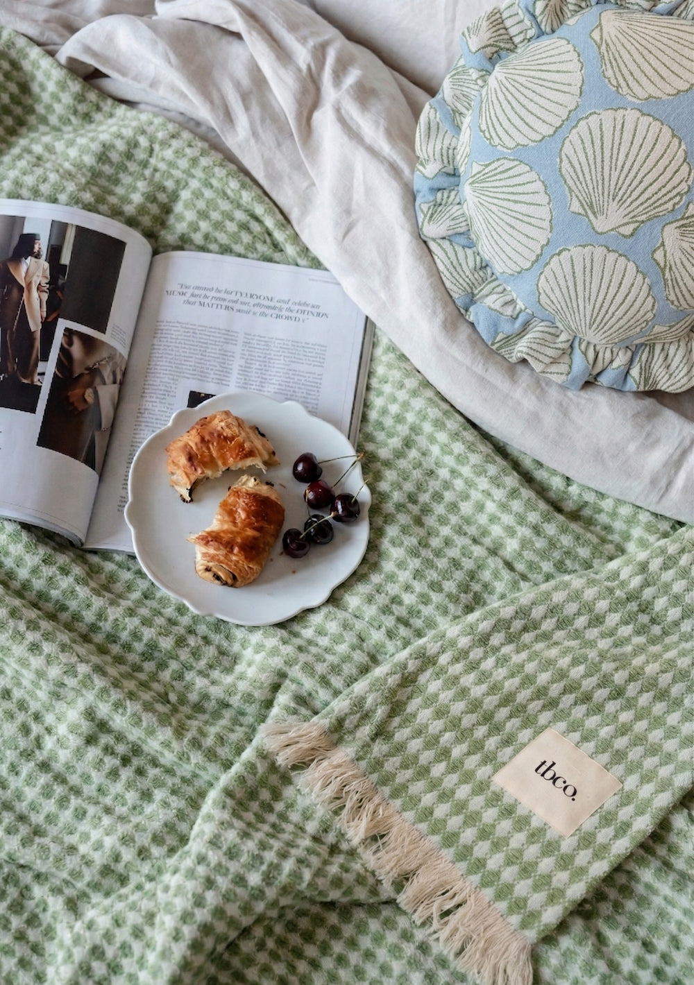 Cotton Throw in Green Argyle by TBCo with woven jacquard texture, natural and recycled fibres, Certified B-Corp, women-founded, designed to make an impact