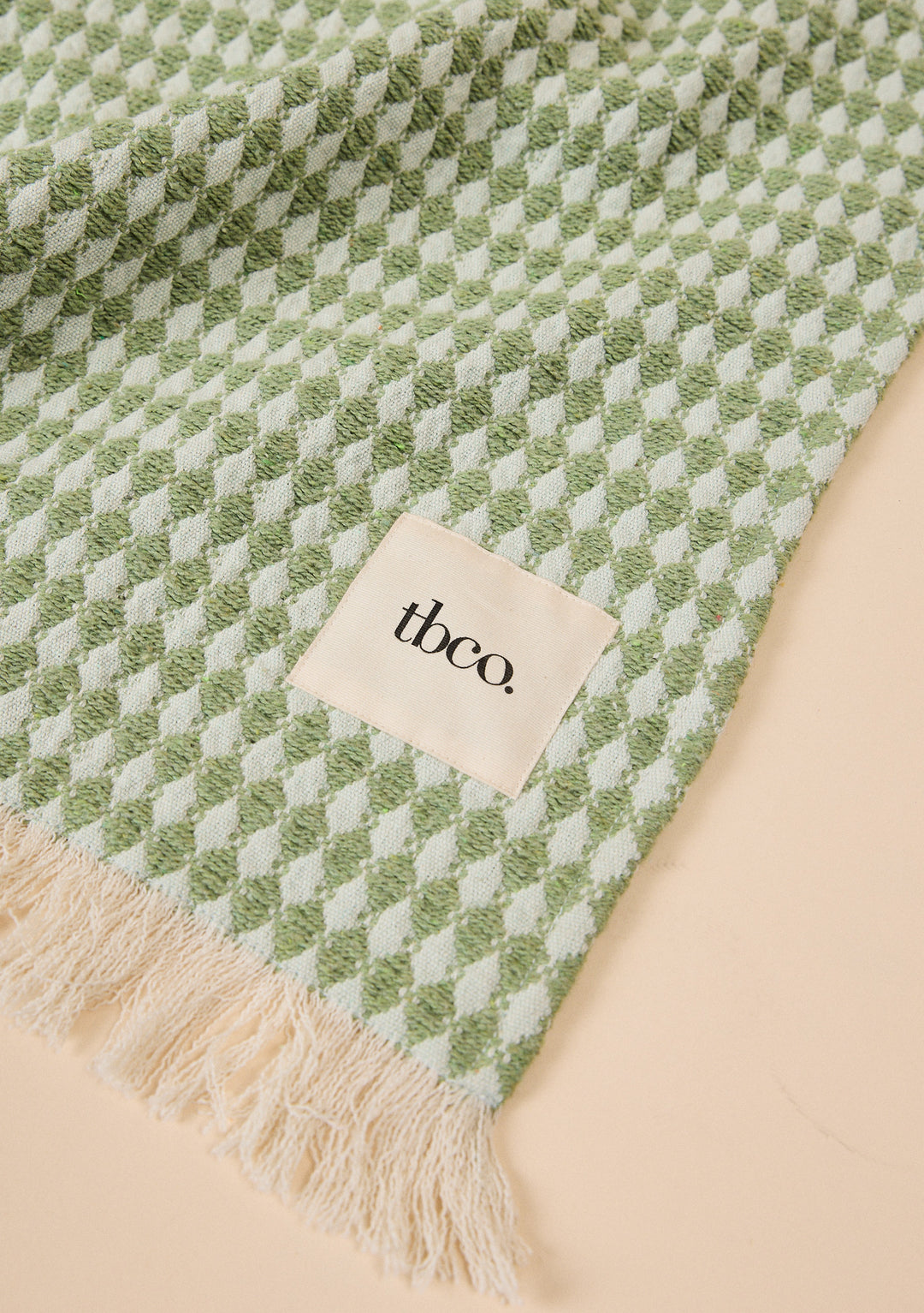 Cotton Throw in Green Argyle by TBCo with jacquard weave, natural and recycled fibres, Certified B-Corp, Women-Founded, designed to make an impact