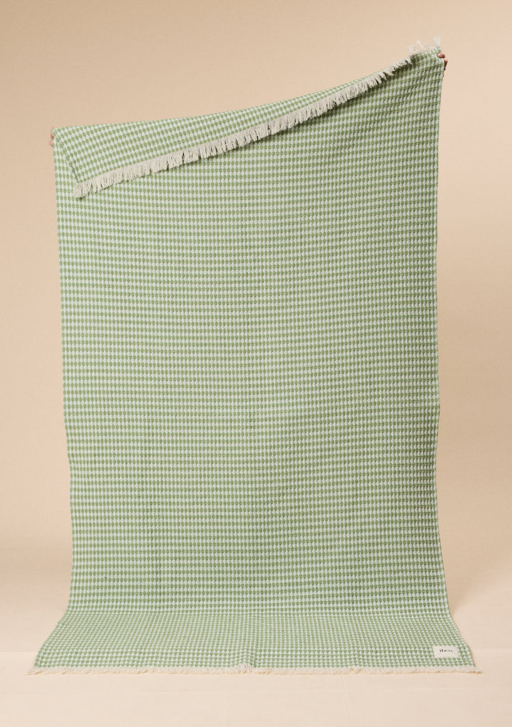 Cotton Throw in Green Argyle by TBCo with jacquard weave, natural and recycled fibres, Certified B-Corp, women-founded, designed to make an impact
