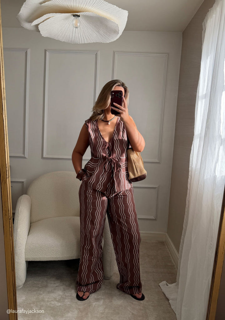 Woman wearing TBCo Cotton Trousers in Brown Wave with natural fibres, Certified B-Corp, Women-Founded, designed to make an impact