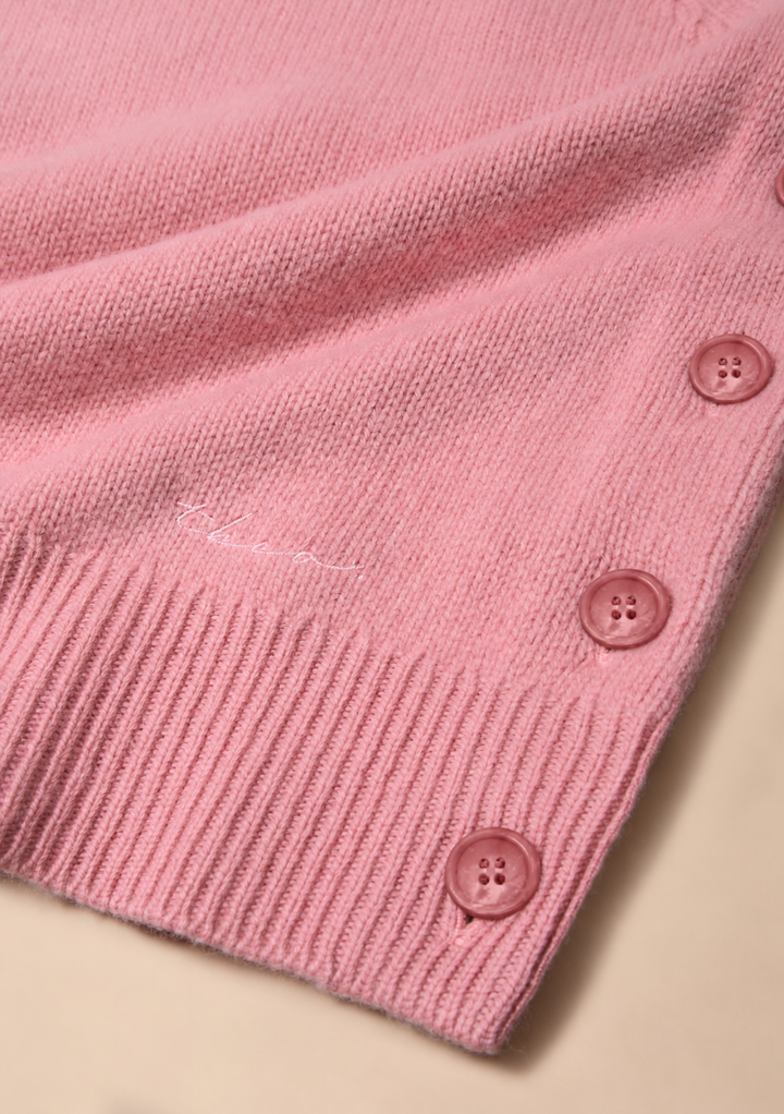 Gilet boutonné en laine mérinos rose