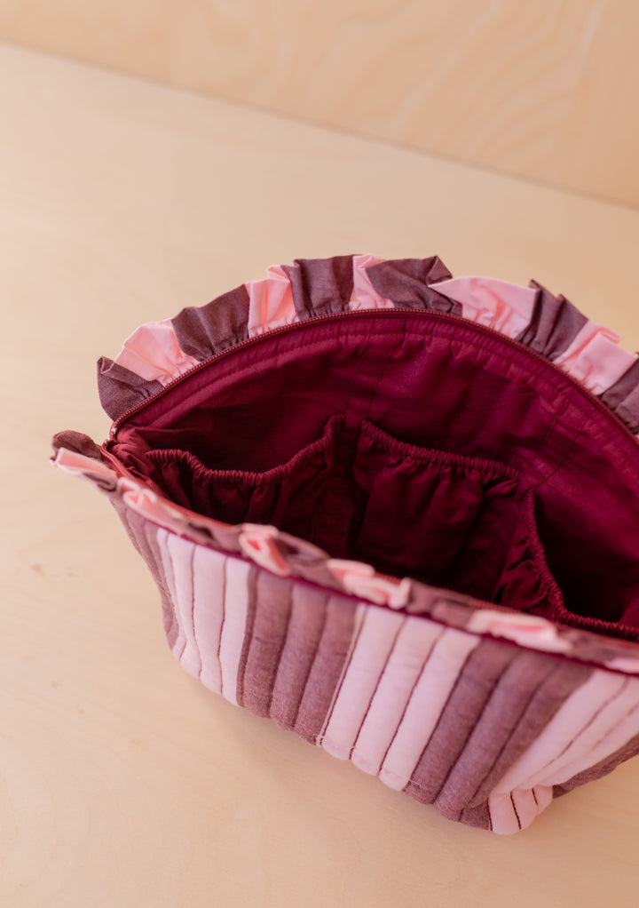 Open Cotton Wash Bag in Pink & Burgundy Stripe by TBCo showing ruffled top and interior elasticated pockets