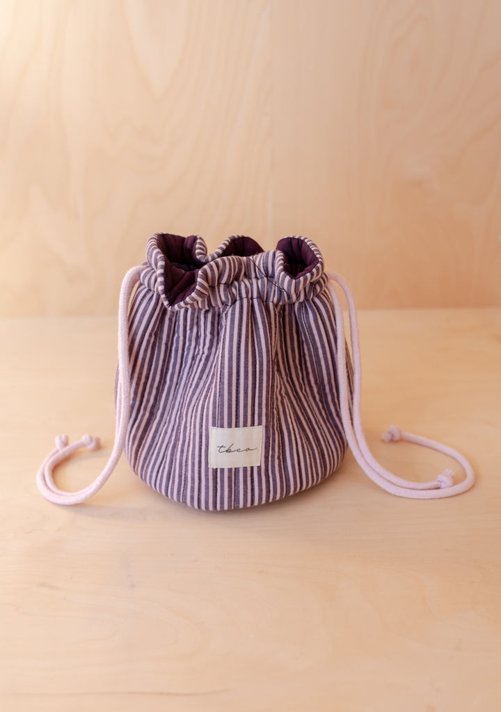Cotton Wash Bag in Burgundy Stripe by TBCo with drawstring closure shown in gallery position 1 portrait view